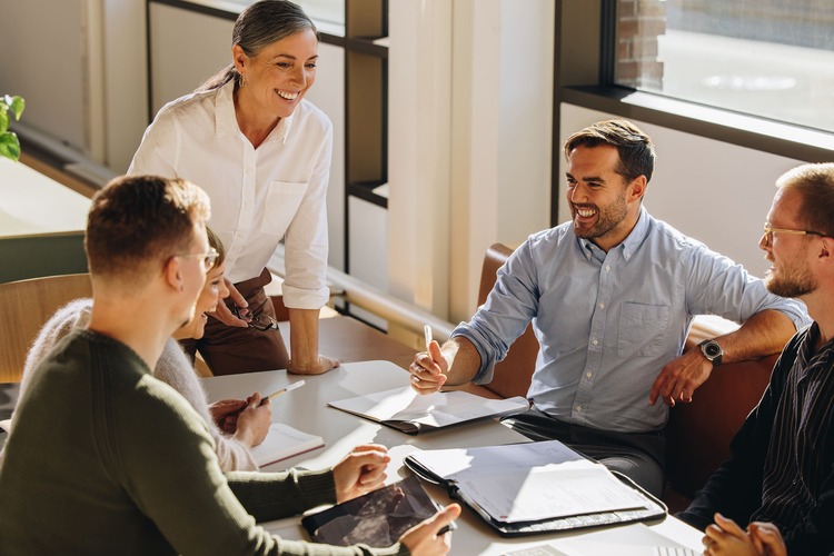 ppt-6569953001541-Smiling female executive talking in meeting